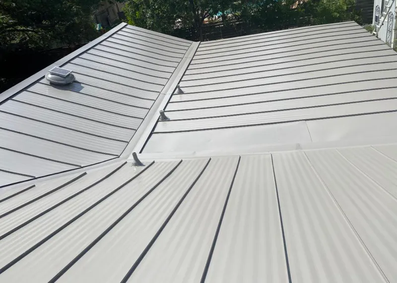 Solar attic fan installed on a metal roof for Roof Ventilation in Chantilly